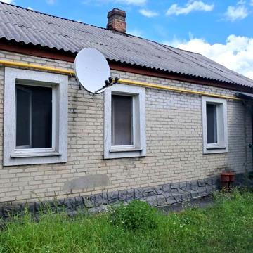Квартира в бараку з гаражем та городом