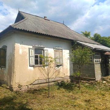 Будинок поблизу річки у с. Мала Обухівка