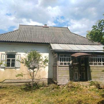 Будинок поблизу річки у с. Мала Обухівка