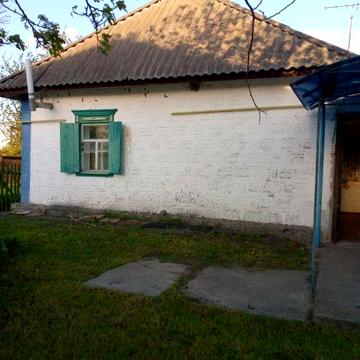 Хата глинобитна обкладена плиткою