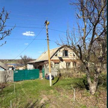 Продам дом в Новом Мерчике , на берегу водохранилища .Участок 25 сотTB