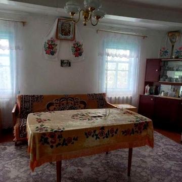 С.Барвинівка.Продам деревяний будинок обкладений цеглою