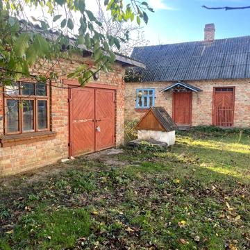 Продам будинок з гаражем , літньою кухнею