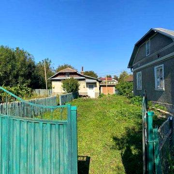 Земельна ділянка з будинком, літньою кухнею та гаражем в с. Озеряни
