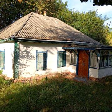 Будинок на березі річки .  Великі Канівці