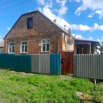 Продам дом в Люботине на два входа, пруд, парк, магазины, остановка