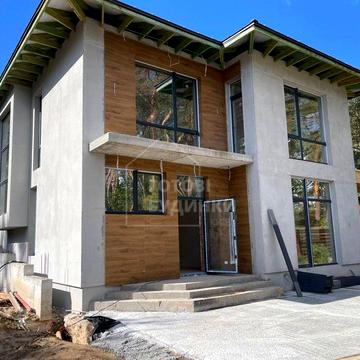 Стильний будинок в КМ Нова Ходосівка. Простора ділянка 11 соток. Ліс