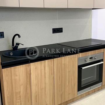 Олега Мудрака вул. (Генерала Наумова), 1-Б