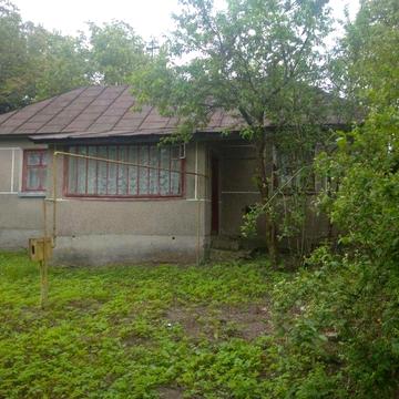 Житловий будинок та земельна ділянка