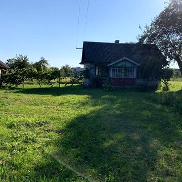 Продам деревяний будинок із ділянкою 0.25 га