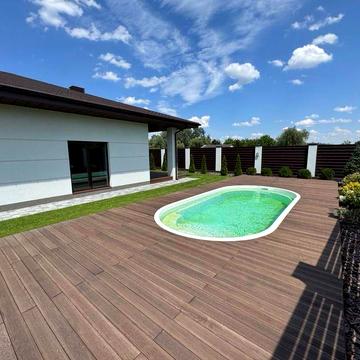 Продажа коттеджа с просторной кухней и приватной территорией