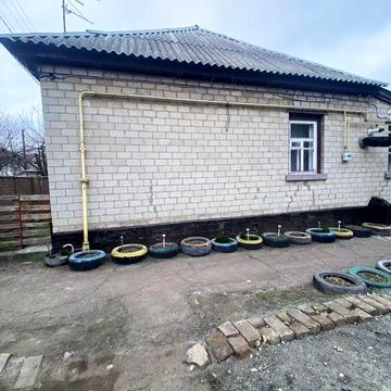 Продаж. 1/2 будинку в центральній частині міста ( район Астри)