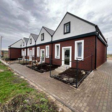 Таунхауси площею 44 м² у тихому та зеленому районі.