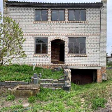 Земельна ділянка з каркасом будинку