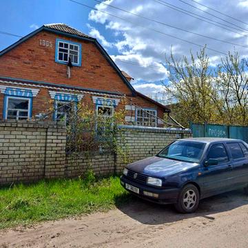 Продам кирпичный дом с большим участком в центре с. Протопоповка (Дергачевский р-н)