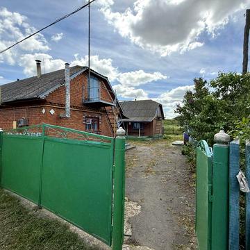 Продаж будинку з літньою кухньою