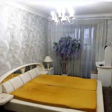 Продам 4-комнатную квартиру в центре