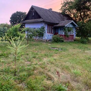 Продам деревяний будинок із ділянкою 0.25 га