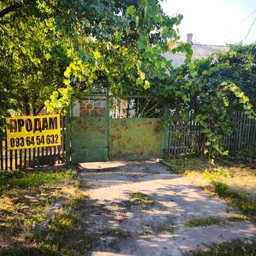 Продам газифікований будинок 53,8 кв.м зі зручностями,гараж,літня кухня,хоз.будівлі,ділянка 18,75 соток,приватизована