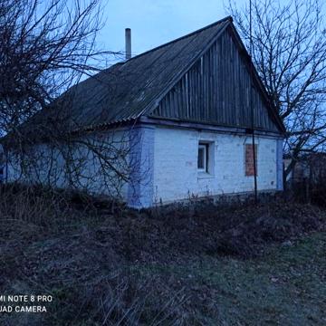 Земельна ділянка з будинком.