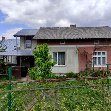 Продаю половину Будинку,цегл гараж та прибуд зем ділянку пл 0.0412Га