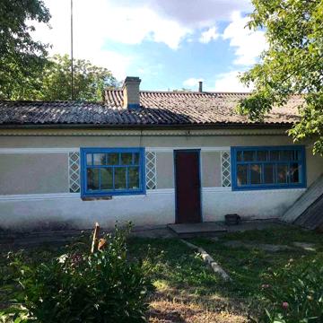 Продаж будинку з гаражем і ділянкою на 52 сотки, вул. Миру 109