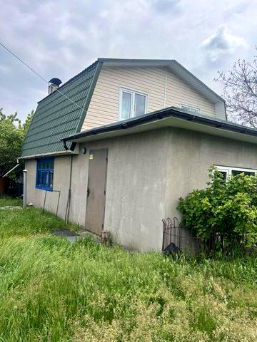 Будинок з господарськими будівлями Романки