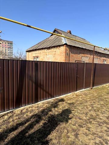 Будинок з приватизованою земельною ділянкою 0.0895 га