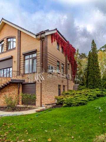 Продаж Котедж Гостомель Канадське Село 4 кімнати 500 м² Басейн Озеро Генератор Гостьовий будинок Лазня Ділянка 70 соток