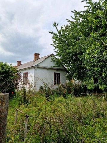 продаж будинку та земельної ділянки
