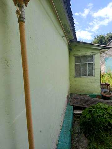 Продам 1/2 будинку на ділянці 6 соток м.Зміїв. Центр,вул.Рогатинська