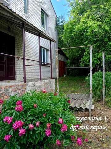 Продам 1/2 частину двоповерхового цегляного будинку.