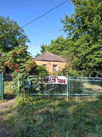смт.Добровеличківка-Центр. Продаж цегляного будинку з ділянкою та госп. спорудами