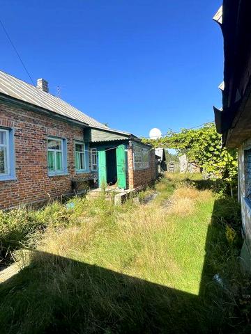 Продам добротний будинок дерев’яний обкладений кирпичем в с. Добрянка