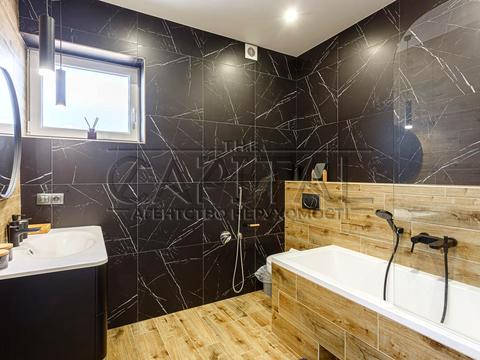 будинок за адресою с. Крюківщина, Георгія Мальцева вул., 1