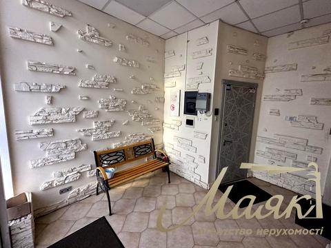 комерційна за адресою Євгена Коновальця вул. (Щорса), 32-Б