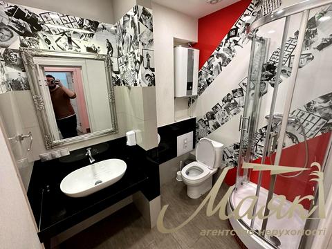 комерційна за адресою Євгена Коновальця вул. (Щорса), 32-Б