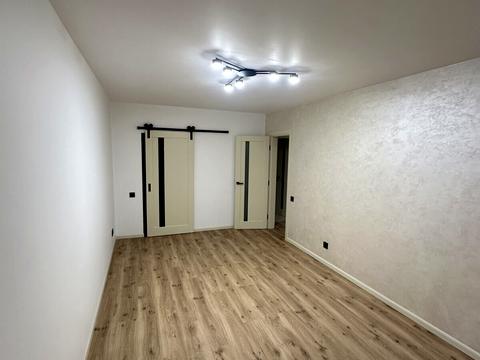 будинок за адресою Коновальця