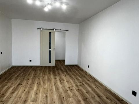 будинок за адресою Коновальця