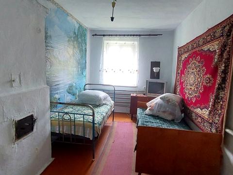 будинок за адресою смт. Вороновиця, Паріївська