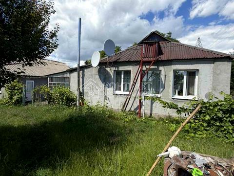 будинок за адресою с-ще. Трійчате (Комсомольське), Залізнична, 21