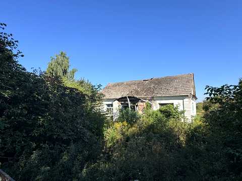 будинок за адресою Корчі вул. (Комсомольська), 32